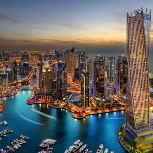 Dubai Marina from a high view showing the boats, sea, and the city scape.