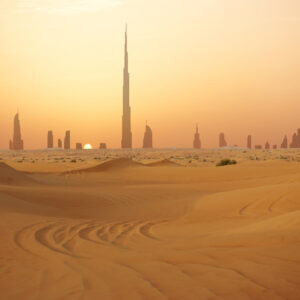 Skyline of Dubai at sunset or dusk, view from Arabian Desert